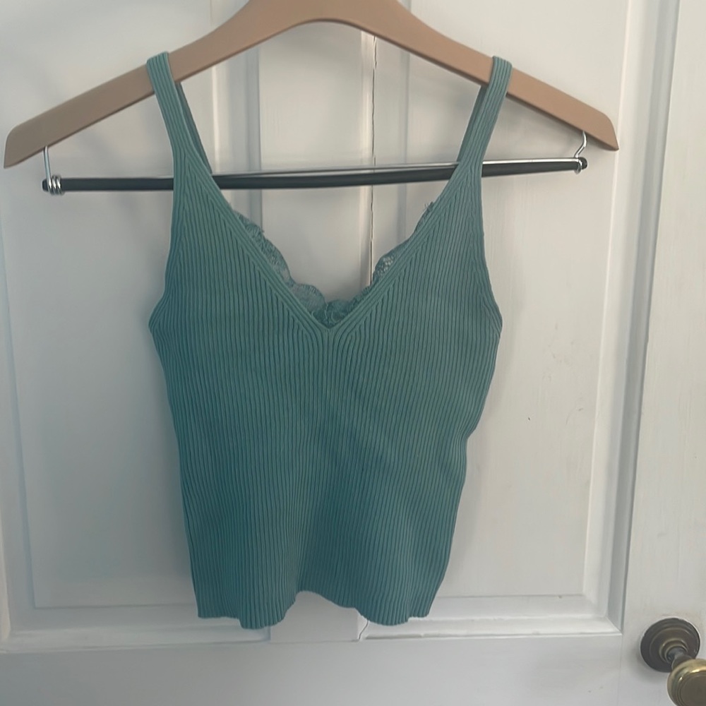 Green/Blue Tank Top. Stretchy material fits body well. V cut with lace on it.